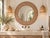 At 48 inches across, this is a mirror that holds a whole wall. The wide frame is stained a deep walnut and covered edge to...