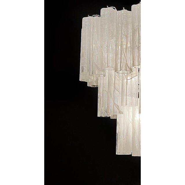 Italian vintage chandelier in Murano glass and nickel-plated metal structure. The armor polished nickel supports 48 large...