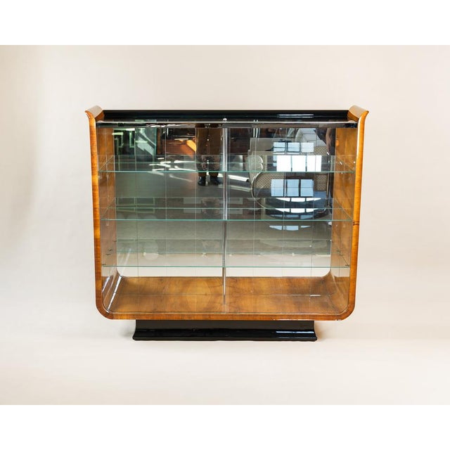 Tulip Display Cabinet byo Jindrich Halabala for Up Závody, 1930s, in Restored conditions. Designed 1920 to 1949 This piece...