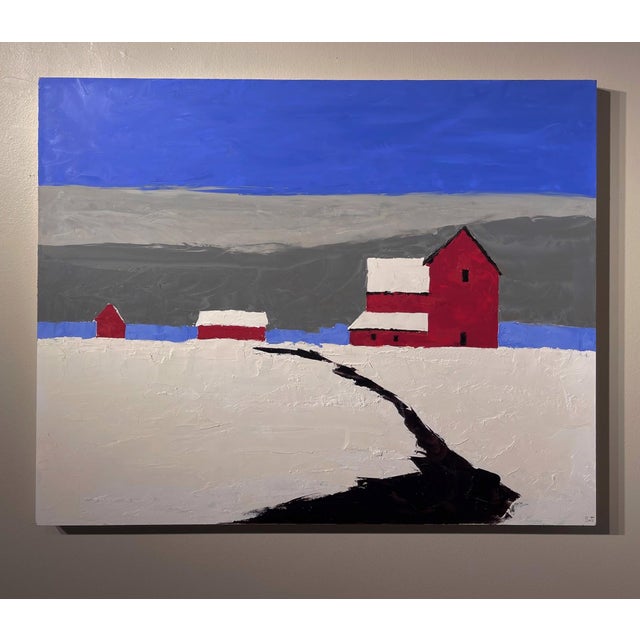 This oil on panel artwork depicts a serene winter landscape featuring a striking red barn and smaller structures set...