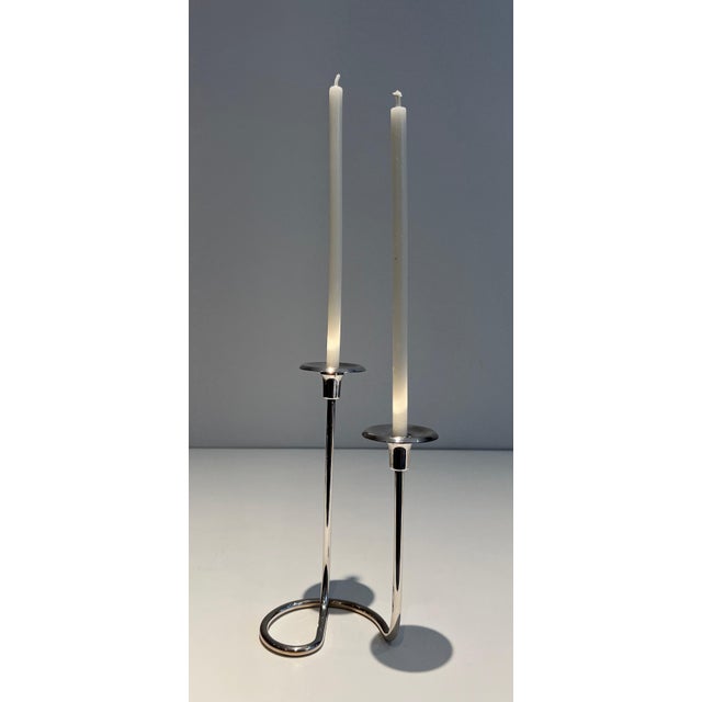 This beautiful designer 2-candle candle holder is made of silver-plated metal and lucite. It is a French work. Circa 1970