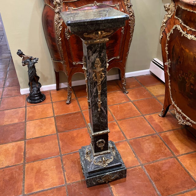 Antique reproduction marble & bronze pedestal, in a verde green marble , with intricate bronze work , depicting wing...