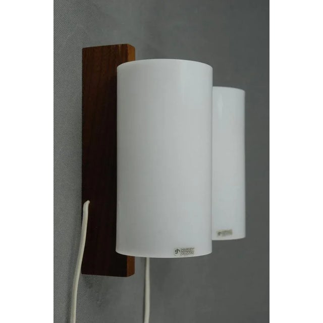 Rarely seen piece from Guzzini combining acrylic with teak. This piece has an attribution mark, I am sure that it is...