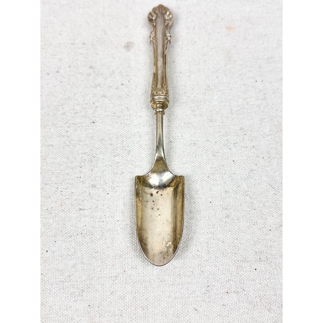 Lovely vintage silver-plated cheese scoop, likely in the "Sweetbrier" pattern by Blackinton. Perfect to use when...