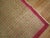 One of a kind vintage Turkish rug with a tight repetitive pattern in raspberries on a camel brown field. 4'1'' x 6'7''