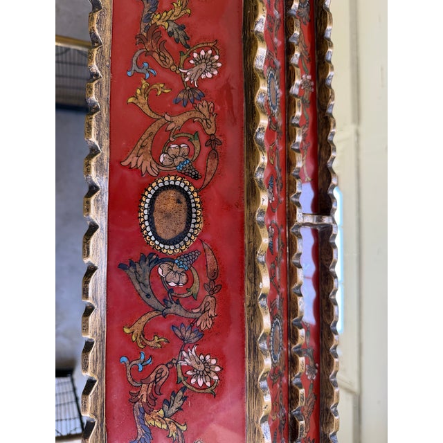 A magnificent vintage Peruvian mirror featuring a hand-carved gilt wood frame inset with individually hand-painted...