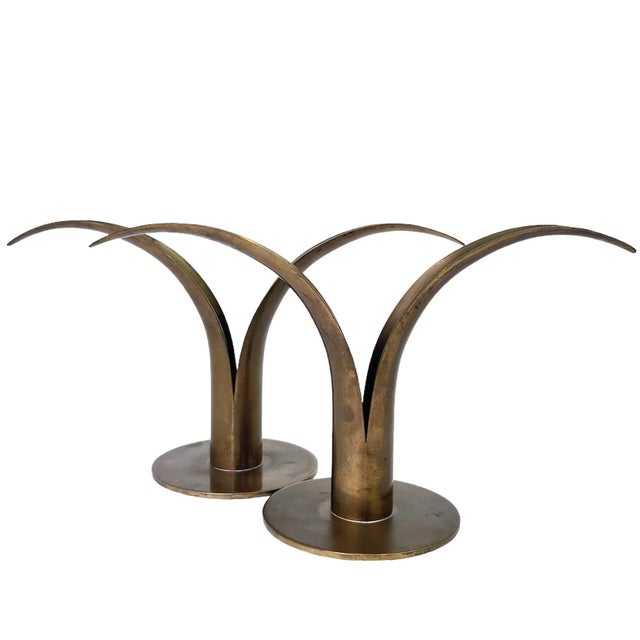 Add a Scandinavian flair to your tabletops with this beautiful pair of iconic brass candlesticks designed by Ivar Alenius...