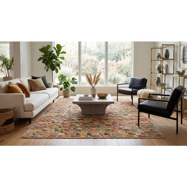 Bring a bold burst of contemporary artistry to your space with this modern Baluch-style wool rug. This eye-catching area...