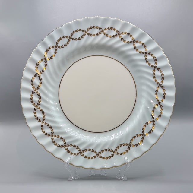 An elegant pair of minton england porcelain dinner plates in the sought-after s600 pattern, beautifully decorated with...
