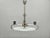 Elegant Art Deco chandelier produced in Czechoslovakia during the 1930s, crafted from chrome plated metal and layered...