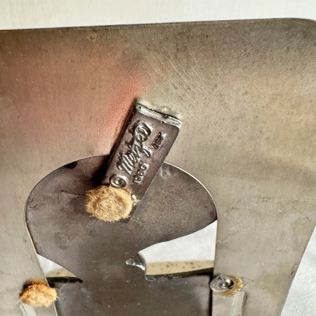 Pair of pewter Metzke bookends, dated 1980. These are both in good condition. They are the same color, just one was...