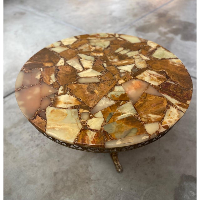 Gorgeous and rare find, Mid-Century Italian Large Onyx and Brass Coffee table. The coloring and details of the onyx is a...