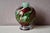 Simply captivating, this Murano blown glass lamp base immediately draws the eye with its swirls of burgundy red that curl...