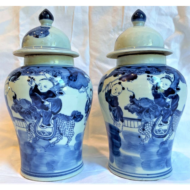 Ceramic Chinoiserie Small Temple Jars With Children on Dragons - a Pair For Sale - Image 7 of 12