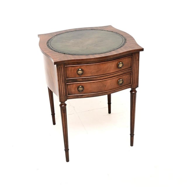 A lovely antique Regency style leather top side table, made in England and dating from around the 1950’s. This is of...