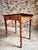 This antique French small writing table, dating from around 1900, is crafted from solid walnut and reflects the...
