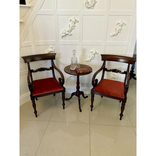 Antique George III quality mahogany circular top lamp table having a quality mahogany circular top supported by a turned...