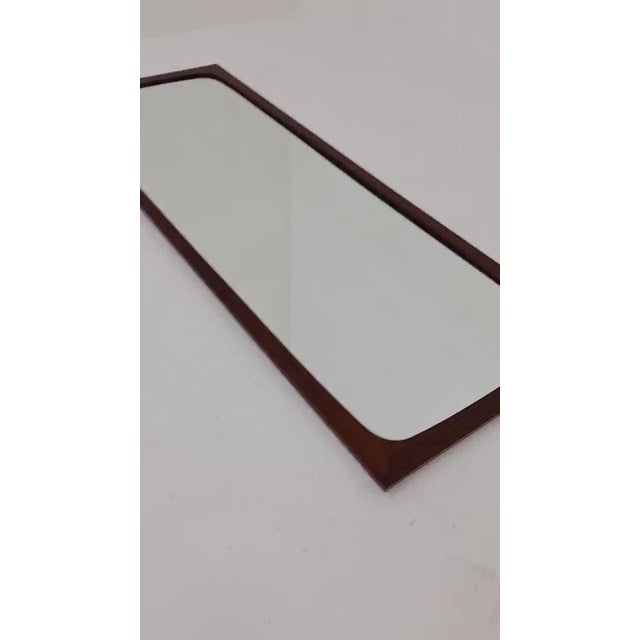 Danish mid-century Modern wall-mounted mirror, 1960s Made in Denmark Height: 116 centimeters Width: 42 centimeters Depth:...