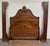 This is a beautifully carved late-Victorian full-size bed crafted in richly grained walnut. The tall arched headboard...