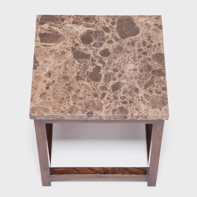 This deceptively simple feng deng (square stool) is a masterpiece of the harmonious design celebrated in traditional...
