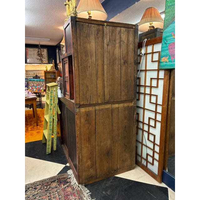 SCREEN PICTURED BEHIND OBJECT IS NOT INCLUDED Japanese elm and pine wood step tansu cabinet. In traditional, compact...