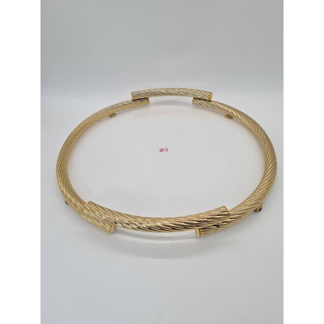 A unique “golden rope” serving tray produced by the german company cl design in the 1970s. It is an elegant example of...