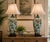 An elegant pair of Art Nouveau-inspired ceramic table lamps featuring gracefully proportioned ovoid bodies decorated with...