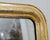 Antique Louis-Philippe mercury mirror from the late 19th century. Its wooden frame displays lovely tones and beautiful...