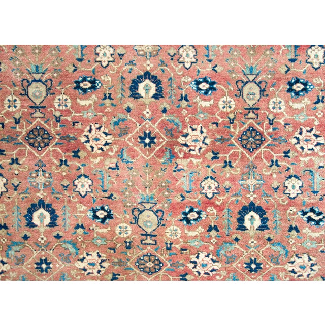 A beautiful mid-20th century Persian Khoy rug with an all-over floral trellis pattern woven in repeated large-scale...