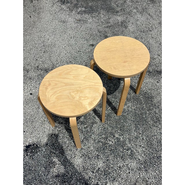 Pair of vintage 1990s IKEA Frosta stools crafted from laminated birch plywood with sculptural bentwood legs. The...