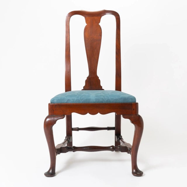 American Queen Anne old growth mahogany upholstered slip seat side chair. The square seat is fitted to a conforming...