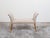 A French giltwood bench from the mid 20th century, with out-scrolling arms, saber legs and new upholstery. Created in...