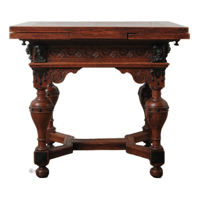 Antique Renaissance Revival Extendable Oak Table With Carved Masks and Ornate Detailing For Sale