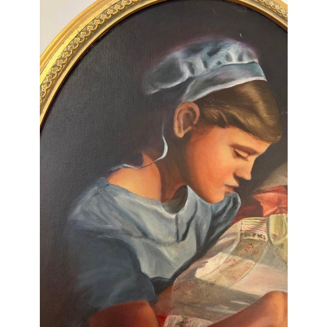 Oval shaped oil painting "The Quilter" by Susan Shank, produced in 1993 in Carlisle, Pennsylvania. This painting shows a...