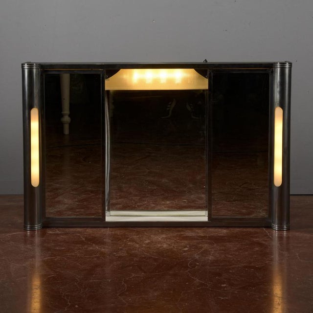 This vintage bathroom mirror is an iconic piece of modern art that captures the essence of the 1950s to 1970s style. The...