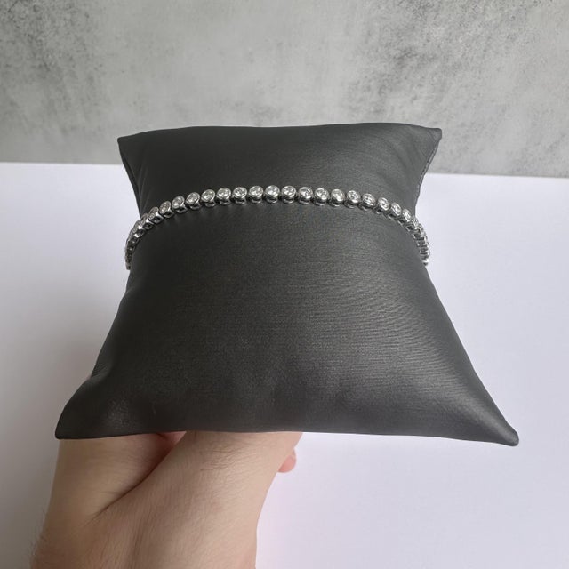 Add a touch of elegance to your jewelry collection with this stunning 14kt White Gold Bezel Set Natural Diamond Tennis...