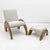 Elegant lounge set composed of an armchair and matching ottoman, distinguished by its sculptural and contemporary design,...