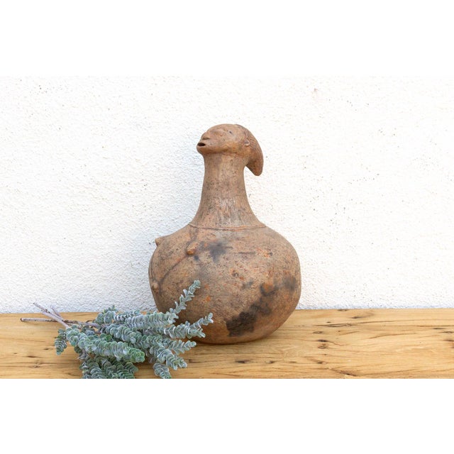 This 15-inch high vessel is a classic example of the sophisticated pottery traditions of the Mangbetu people from the...