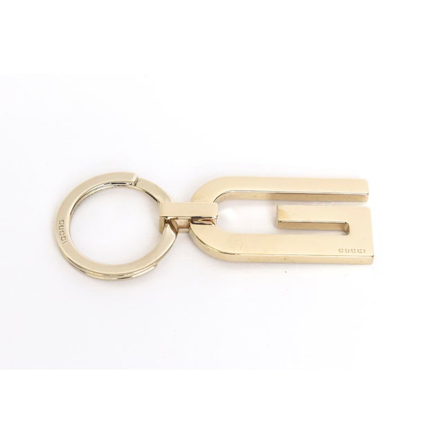 This wonderful vintage Gucci keychain is gold plated and unisex. It is hallmarked and comes in its own flap case and box....