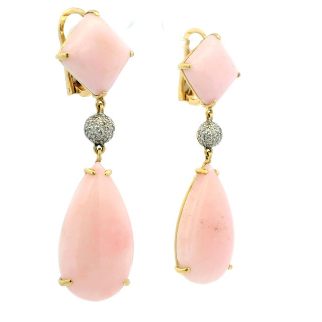 A glamorous pair of vintage drop earrings dating to circa 1980, crafted in richly polished 18K yellow gold and set with...