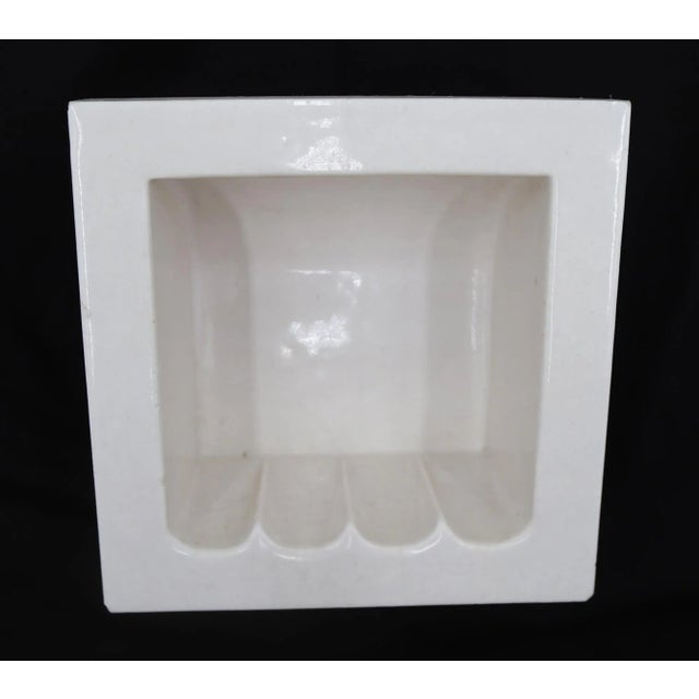 Flush mount square bathroom soap dish made of white porcelain over ceramic with a crackle surface. Made by Fairfacts Co....