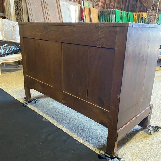 French Empire style mahogany commode, 19th c., having marble top, hidden frieze drawer, over three additional drawers,...