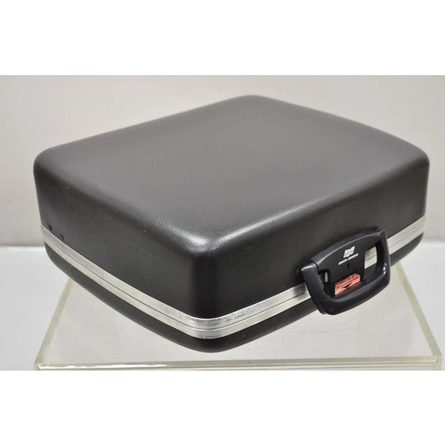 Vintage Smith Corona Sterling Manual Portable Typewriter with Hard Case. Circa 1970s. Measurements: 6" H x 14.5" W x 13"...