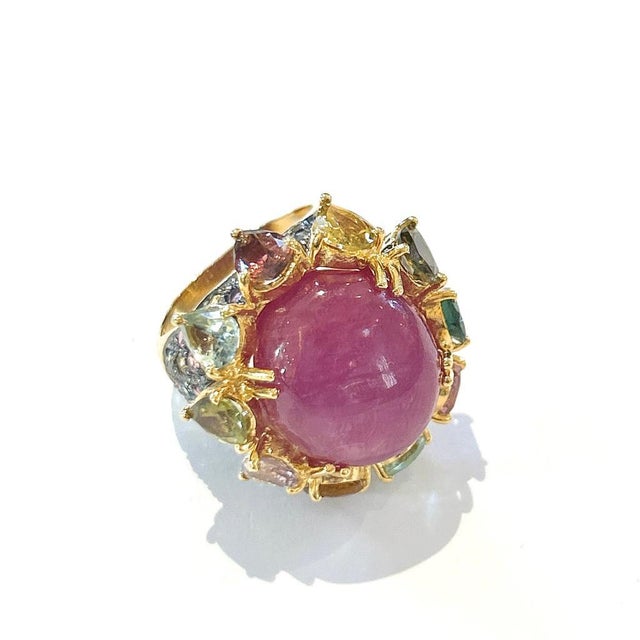 This is part of Chairish’s Fine Jewelry assortment. Center Oval Shape Natural Ruby - 4 Carat Multi color Natural Sapphires...