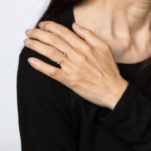 Stylish estate open diamond claw ring crafted in 14 karat rose gold. Pave set diamonds total an estimated 0.35 carats...