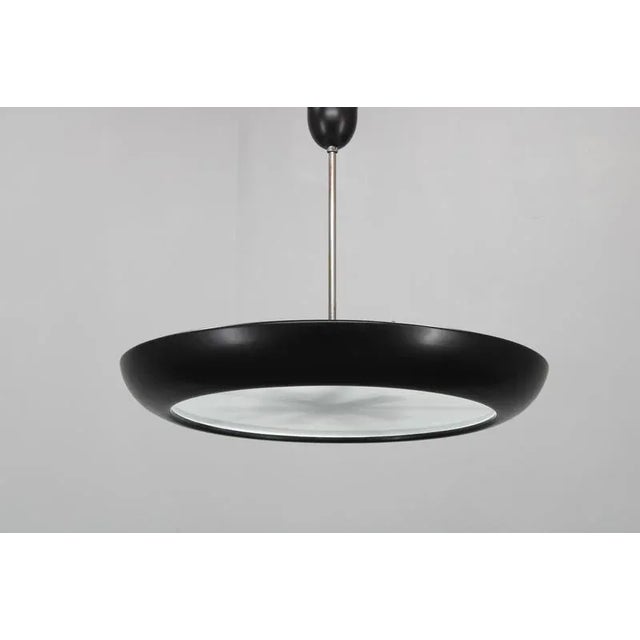 Restored large bauhaus "ufo" pendant light, designed by josef hurka for napako and produced in czechoslovakia around the...