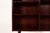Elegant Danish mid-century bookcase in richly grained rosewood veneer, dating from the 1960s. The piece features a...