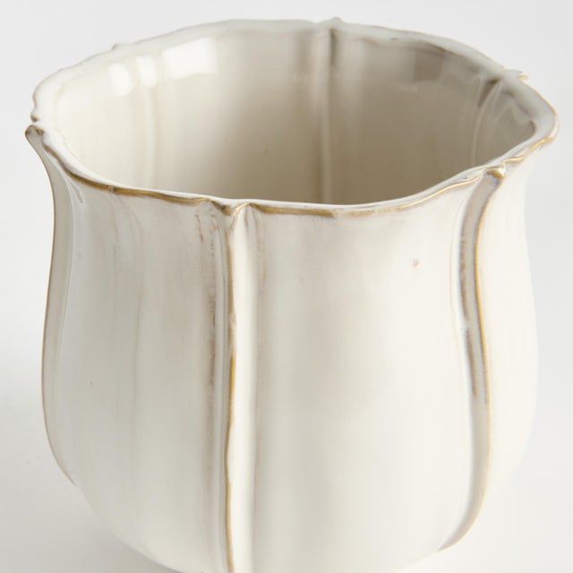 With a classic shape and thickly applied glaze, this Italianinspired pot is a work of art. The handfinished petallike...