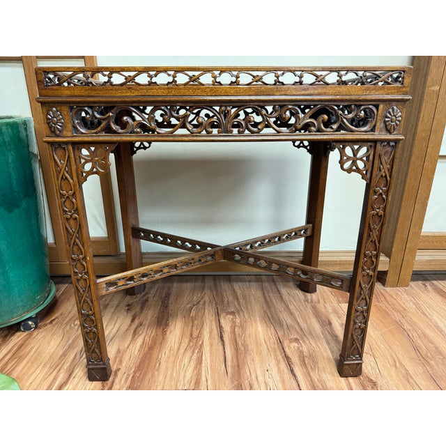 Simply gorgeous! Mahogany and leather Has one small chip in the latticework and some light fading in the leather as seen...