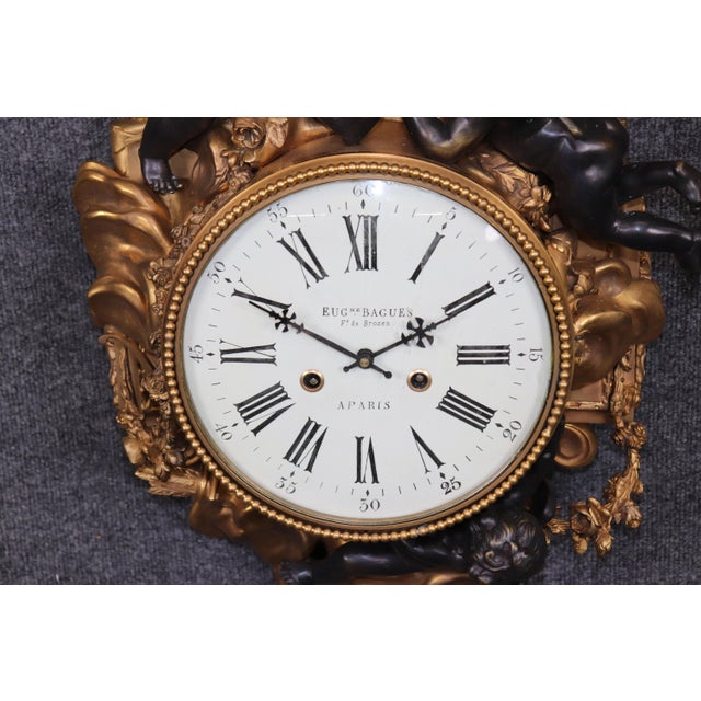 This exceptional 1920s French bronze cartel clock by Eugène Baguès is a masterful expression of Parisian decorative arts,...